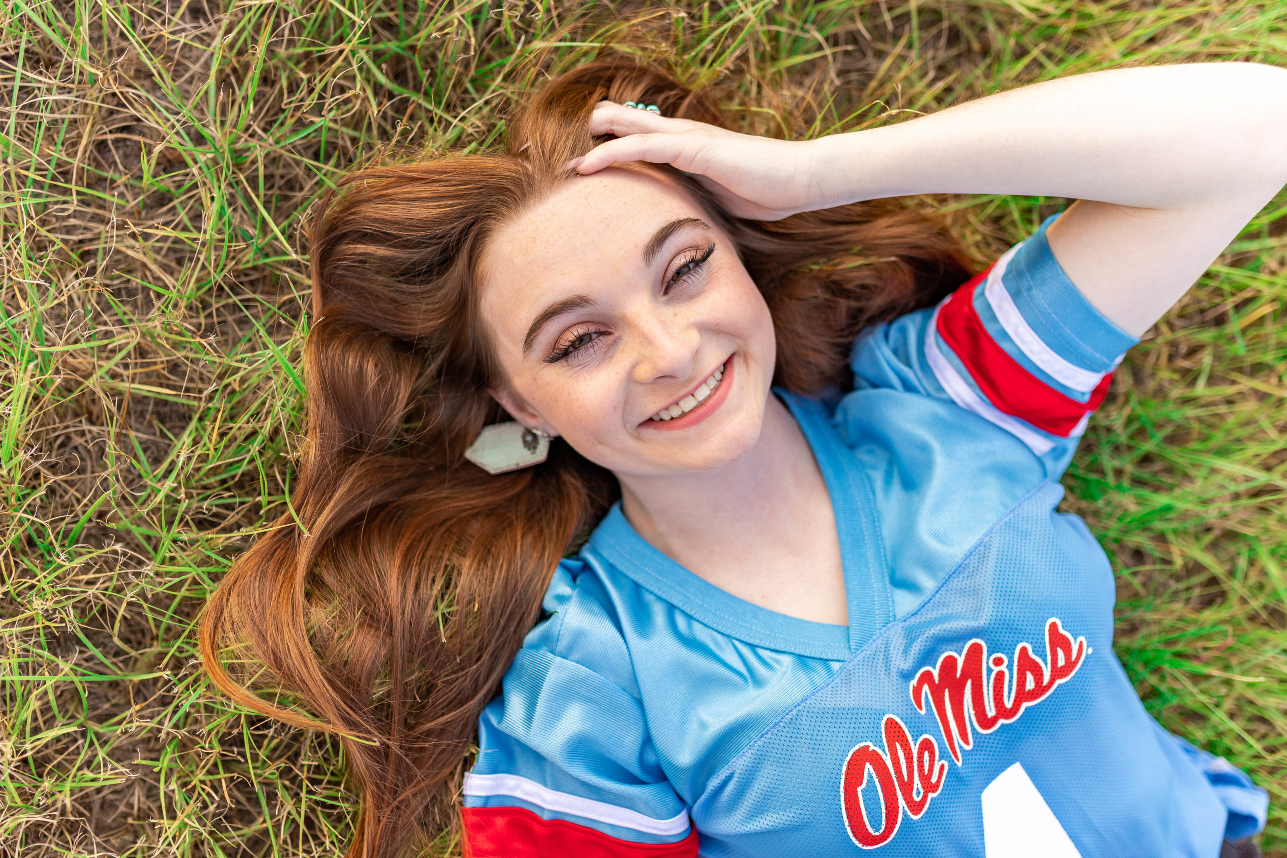 Mississippi senior posing with hand in hair