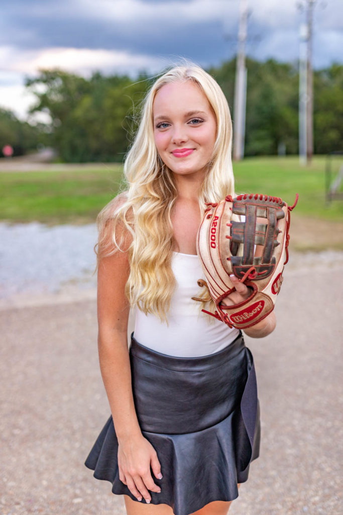 senior girl with softball glove